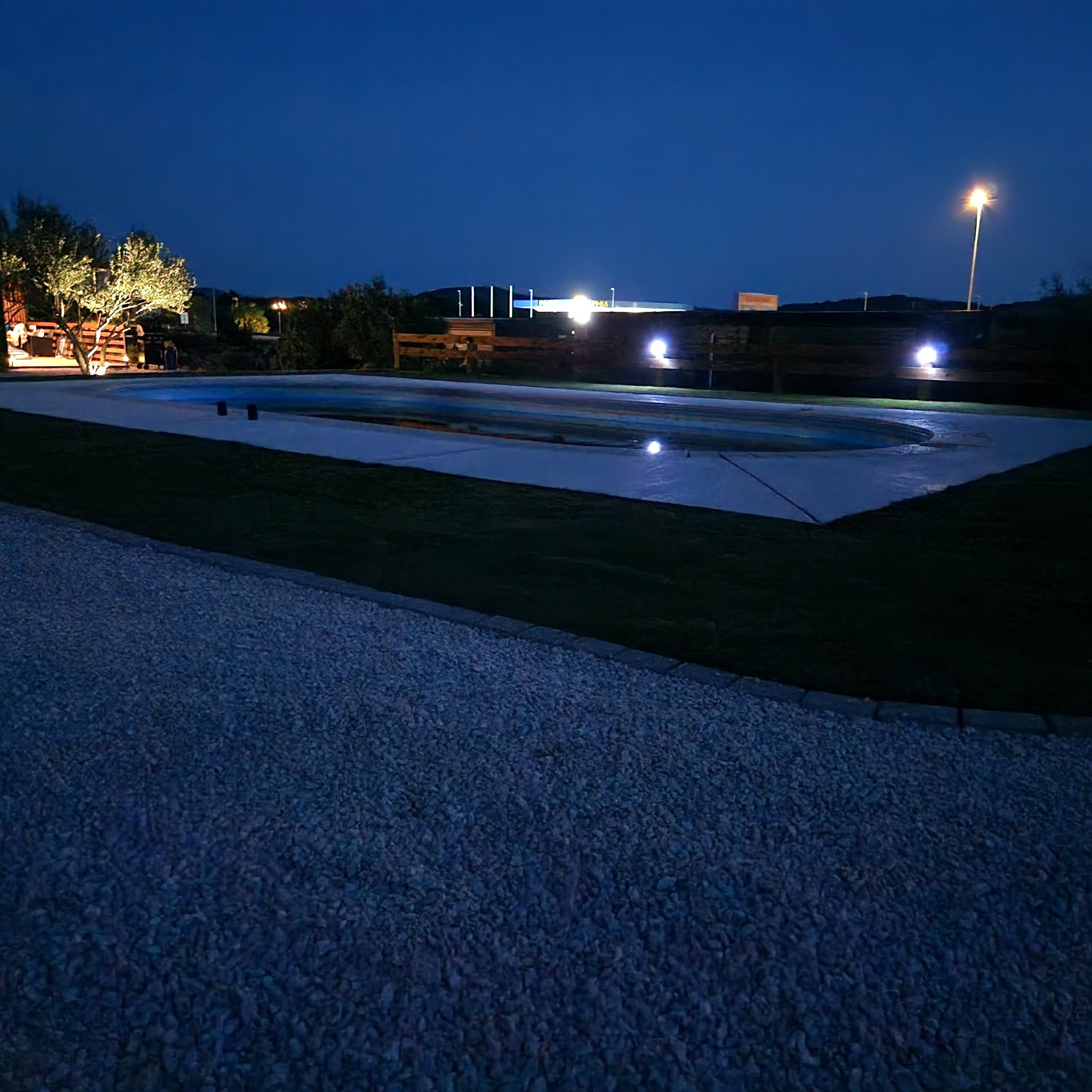 Albatross I - evening view of the pool and landscaped surroundings