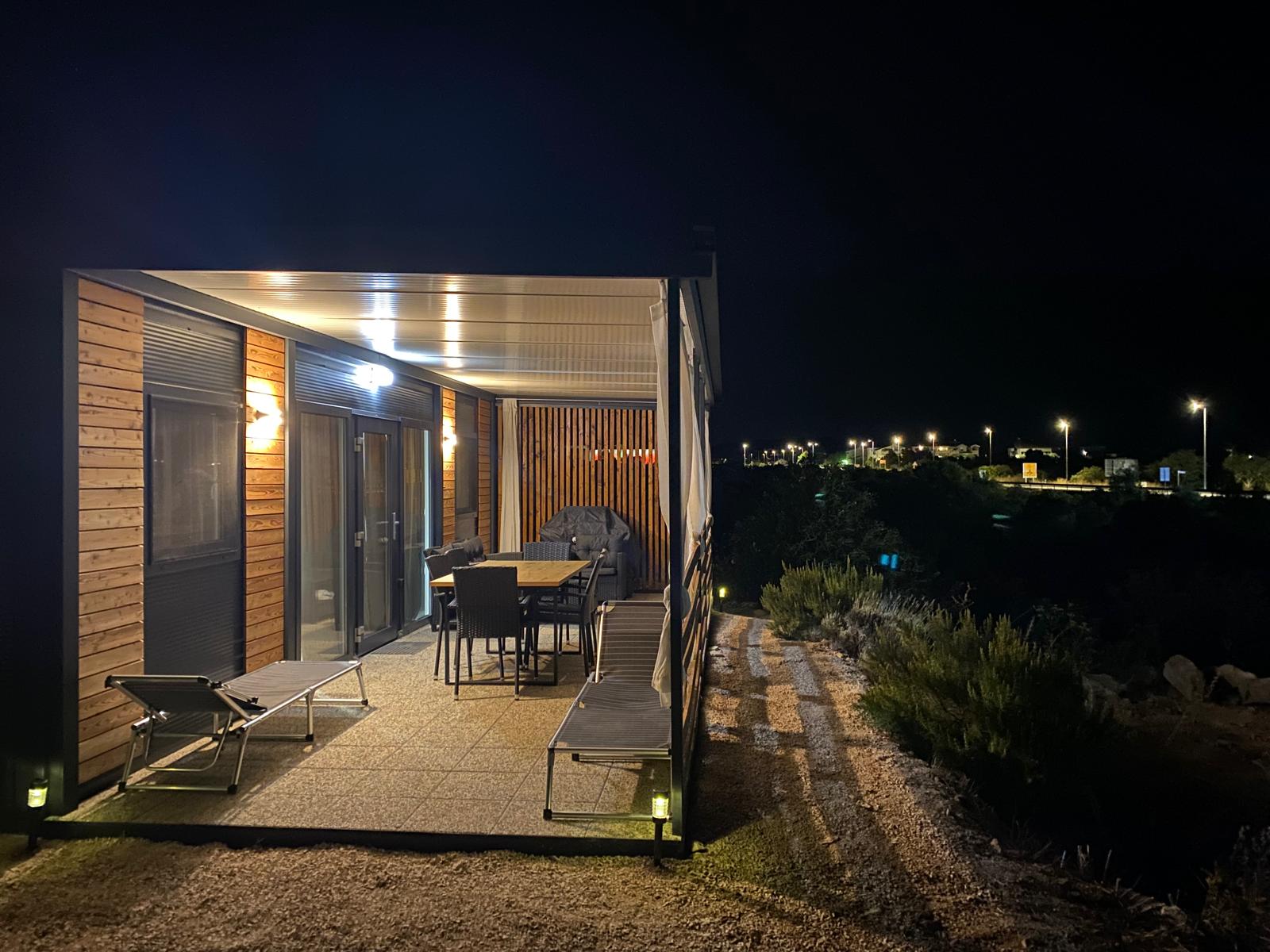 Albatross III - illuminated mobile home terrace in the evening atmosphere