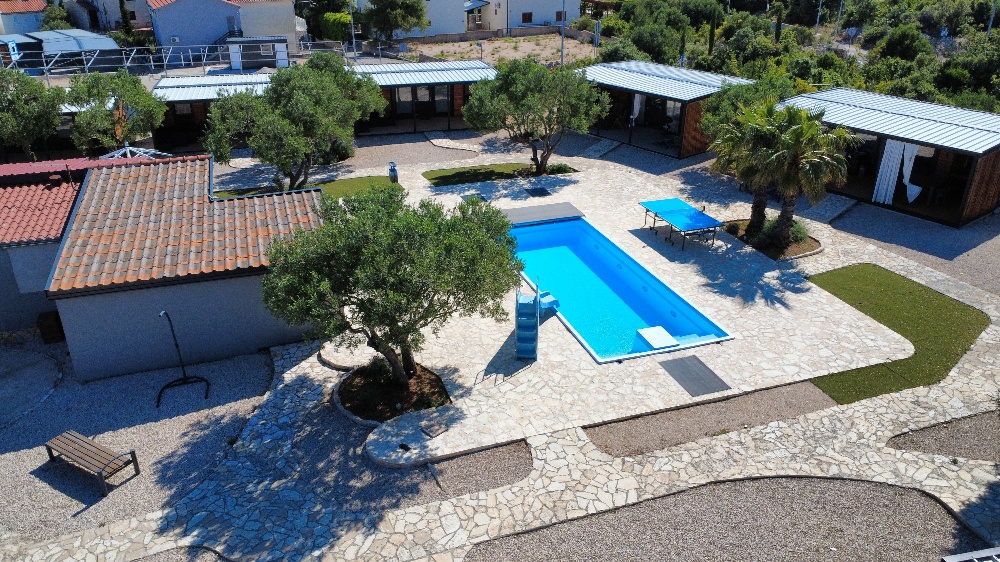 Aerial view of the pool and shared outdoor area at the property